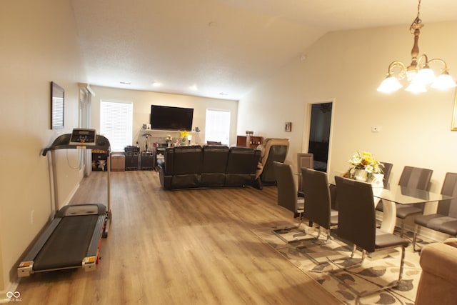 291 Lakemoore St, Brownsburg, IN 46112 - dining space featuring a chandelier, wood finished floors, and vaulted ceiling