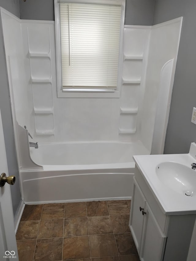 94 N Routiers Ave, Indianapolis, IN 46219 - full bath featuring vanity, shower / washtub combination, and stone finish flooring