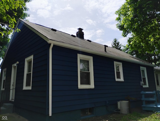 94 N Routiers Ave, Indianapolis, IN 46219 - view of side of home featuring entry steps and a chimney