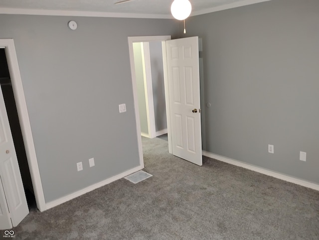 94 N Routiers Ave, Indianapolis, IN 46219 - unfurnished bedroom with carpet flooring and crown molding