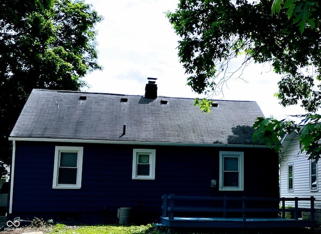 94 N Routiers Ave, Indianapolis, IN 46219 - back of property with a chimney, a wooden deck, and a shingled roof