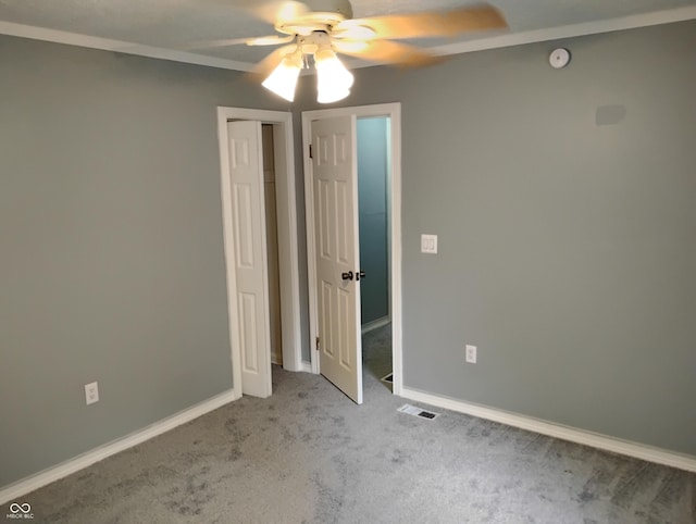 94 N Routiers Ave, Indianapolis, IN 46219 - unfurnished bedroom featuring light colored carpet and a ceiling fan