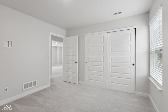 1911 Goodwin Pl, Westfield, IN 46074 - unfurnished bedroom featuring carpet flooring, multiple windows, and a closet