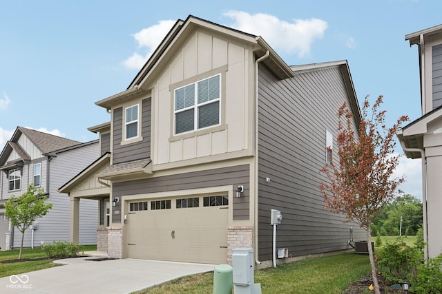 1911 Goodwin Pl, Westfield, IN 46074 - view of front of house featuring board and batten siding, driveway, a garage, and a front lawn