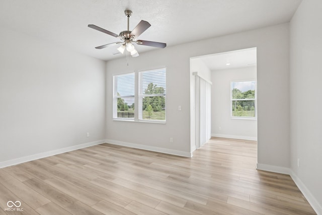 1911 Goodwin Pl, Westfield, IN 46074 - empty room featuring plenty of natural light, light wood finished floors, and ceiling fan