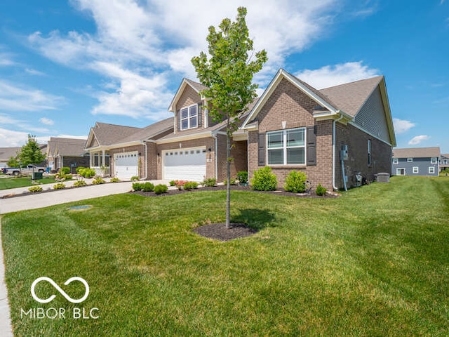 8866 Twain Ln, Indianapolis, IN 46239 - view of front facade featuring brick siding, concrete driveway, a front yard, and an attached garage