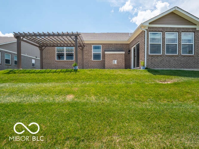 8866 Twain Ln, Indianapolis, IN 46239 - back of property featuring a pergola, brick siding, and a yard