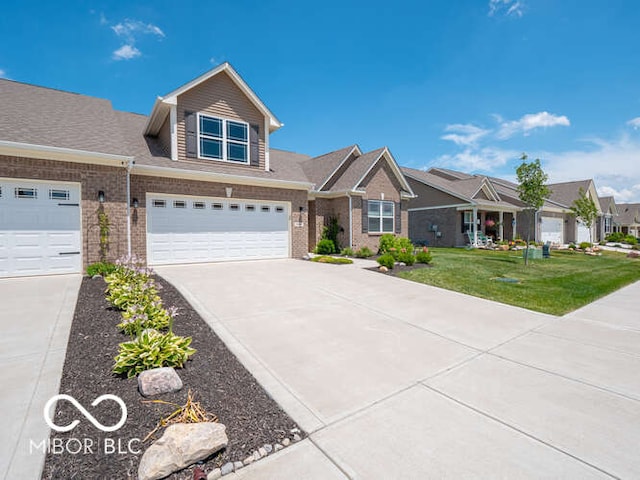 8866 Twain Ln, Indianapolis, IN 46239 - view of front facade featuring concrete driveway, a front yard, brick siding, a residential view, and a garage