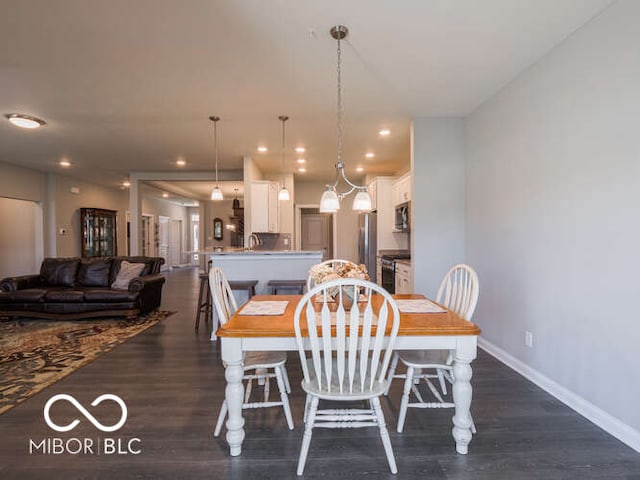 8866 Twain Ln, Indianapolis, IN 46239 - dining space featuring recessed lighting and dark wood-style floors
