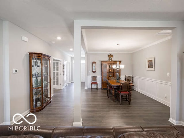 8866 Twain Ln, Indianapolis, IN 46239 - dining space with dark wood-style flooring, crown molding, a chandelier, and recessed lighting