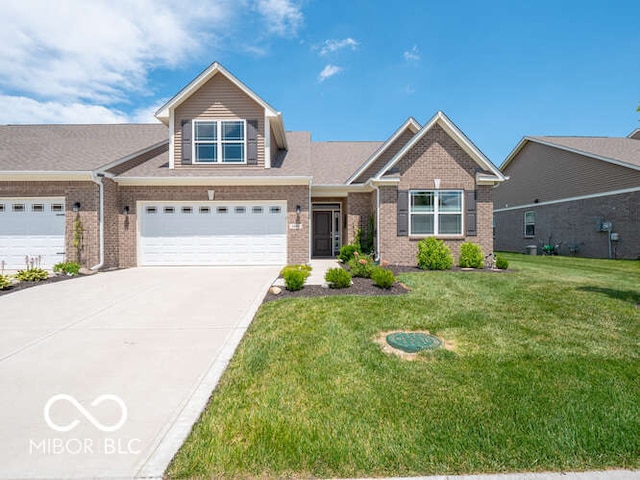 8866 Twain Ln, Indianapolis, IN 46239 - view of front of property featuring brick siding, concrete driveway, and a front yard