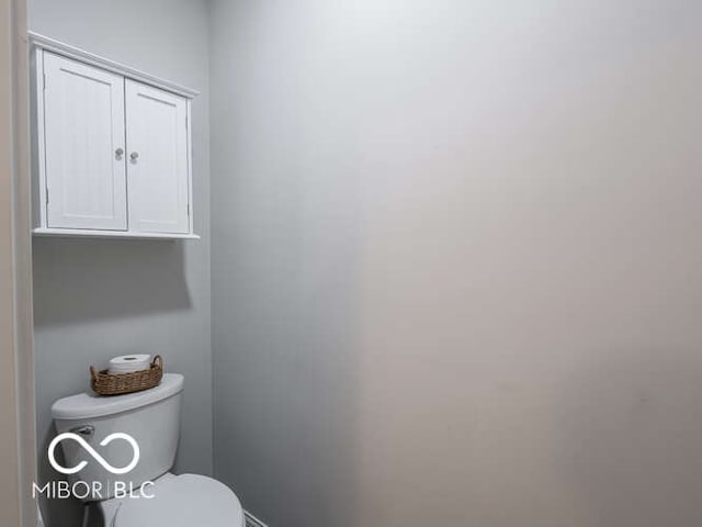 8866 Twain Ln, Indianapolis, IN 46239 - bathroom featuring toilet and baseboards