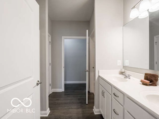 8866 Twain Ln, Indianapolis, IN 46239 - full bathroom featuring double vanity and wood finished floors