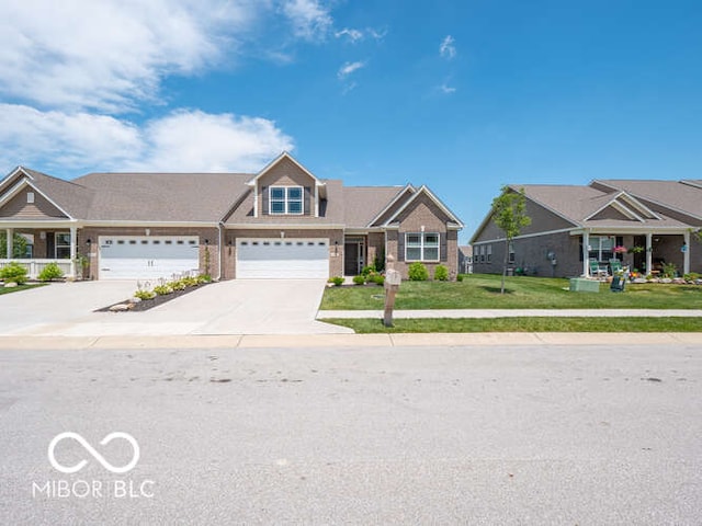 8866 Twain Ln, Indianapolis, IN 46239 - view of front of house with driveway, a front lawn, and brick siding