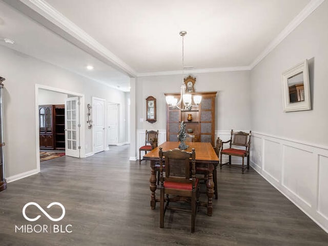 8866 Twain Ln, Indianapolis, IN 46239 - dining space with dark wood-type flooring, a chandelier, and crown molding