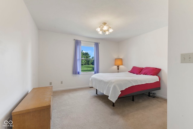 1016 W Creek Ridge Dr, Fountaintown, IN 46130 - carpeted bedroom with a chandelier and baseboards