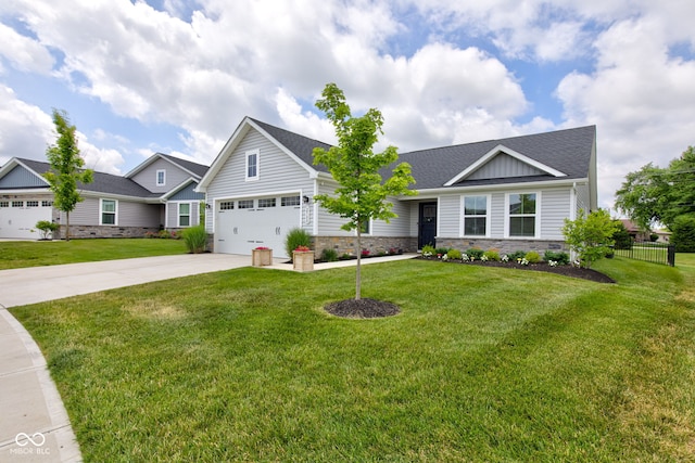 2500 Sand Hollow Dr, Lebanon, IN 46052 - craftsman-style house with concrete driveway, a garage, stone siding, and a shingled roof