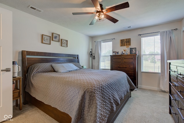 2500 Sand Hollow Dr, Lebanon, IN 46052 - bedroom with light colored carpet and ceiling fan