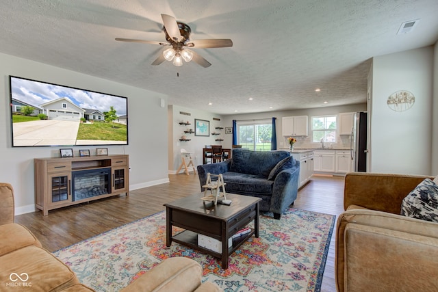 2500 Sand Hollow Dr, Lebanon, IN 46052 - living room featuring light wood finished floors, a textured ceiling, recessed lighting, and a ceiling fan