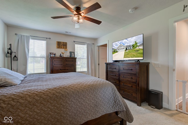 2500 Sand Hollow Dr, Lebanon, IN 46052 - bedroom featuring light carpet and a ceiling fan