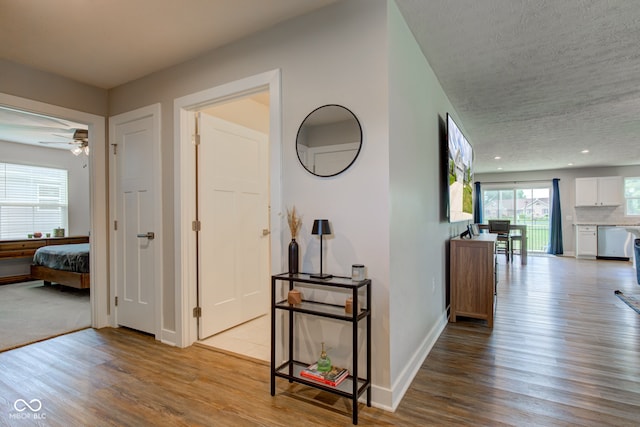 2500 Sand Hollow Dr, Lebanon, IN 46052 - corridor with wood finished floors, a textured ceiling, and recessed lighting