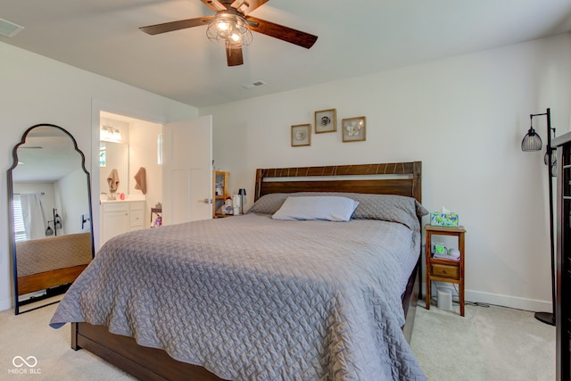 2500 Sand Hollow Dr, Lebanon, IN 46052 - bedroom featuring light carpet, a ceiling fan, and connected bathroom
