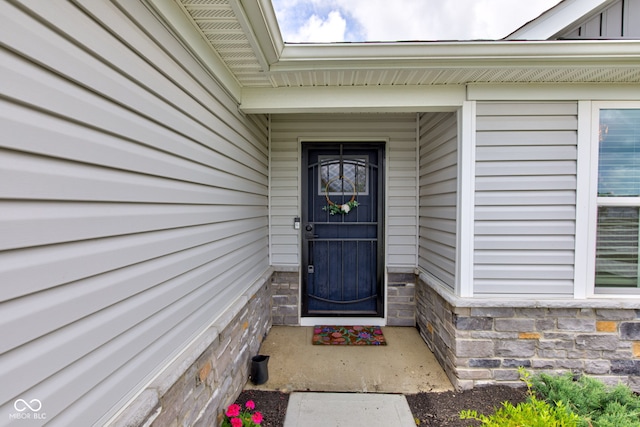 2500 Sand Hollow Dr, Lebanon, IN 46052 - doorway to property featuring stone siding and board and batten siding