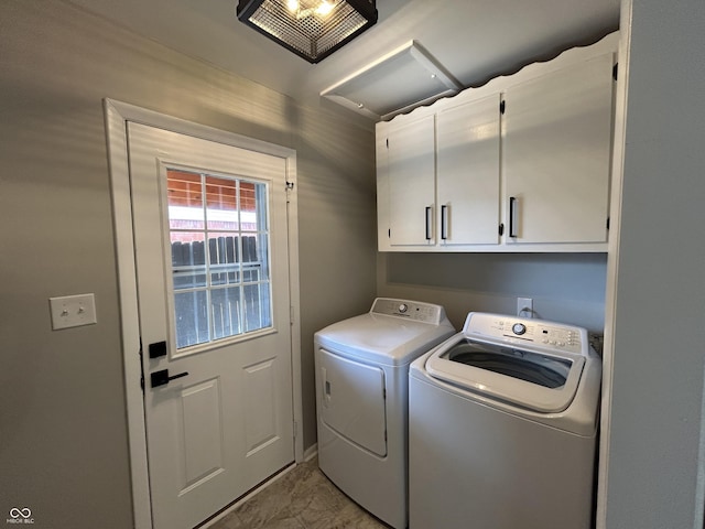 2845 12th St, Columbus, IN 47201 - laundry area with cabinet space, independent washer and dryer, and marble look tiles