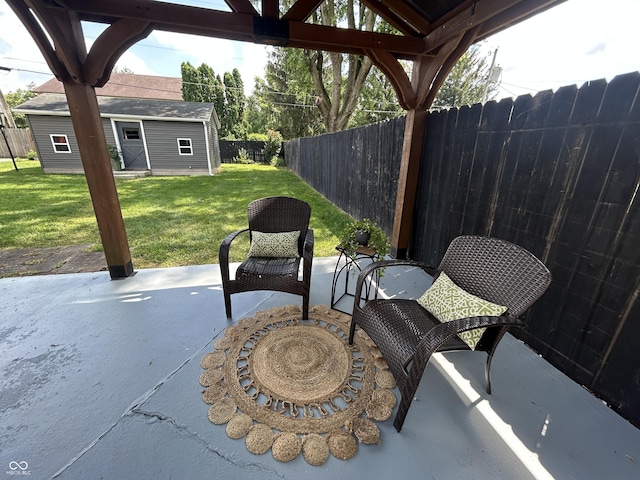 2845 12th St, Columbus, IN 47201 - fenced backyard featuring a patio and an outbuilding