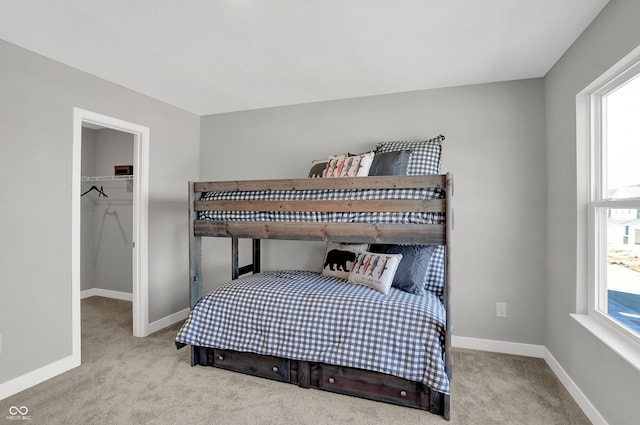 7675 Marin Pkwy, Cumberland, IN 46229 - carpeted bedroom featuring a spacious closet and a closet