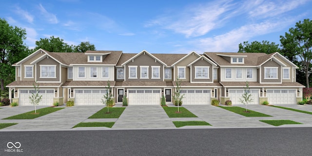 7675 Marin Pkwy, Cumberland, IN 46229 - townhome / multi-family property with driveway and an attached garage