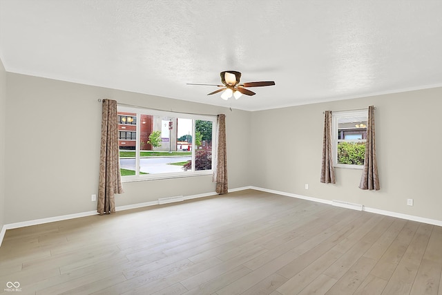 5015 Nowland Ave, Indianapolis, IN 46201 - empty room featuring ceiling fan, a textured ceiling, and wood finished floors