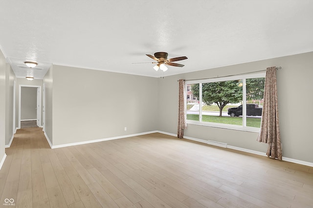5015 Nowland Ave, Indianapolis, IN 46201 - spare room featuring a ceiling fan and light wood-style floors