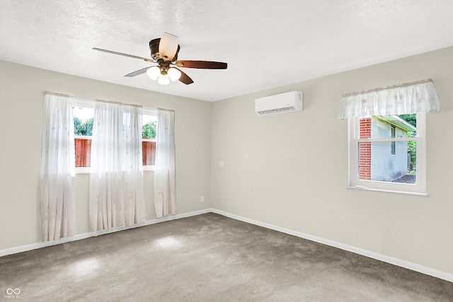 5015 Nowland Ave, Indianapolis, IN 46201 - carpeted spare room featuring a wall unit AC, ceiling fan, and a textured ceiling