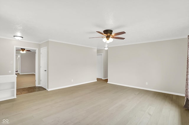 5015 Nowland Ave, Indianapolis, IN 46201 - empty room with ceiling fan, light wood-style floors, and crown molding