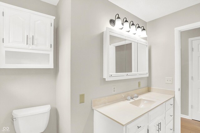 5015 Nowland Ave, Indianapolis, IN 46201 - half bath with vanity and wood finished floors
