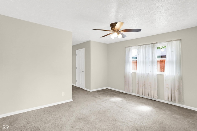 5015 Nowland Ave, Indianapolis, IN 46201 - carpeted empty room with a ceiling fan and a textured ceiling