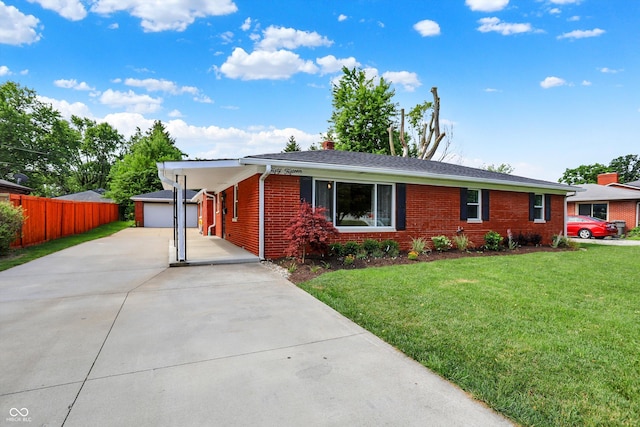 5015 Nowland Ave, Indianapolis, IN 46201 - ranch-style house with brick siding, an outbuilding, and concrete driveway