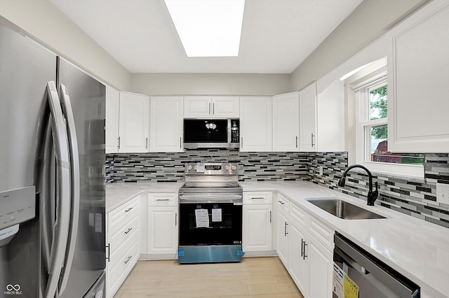 5015 Nowland Ave, Indianapolis, IN 46201 - kitchen featuring stainless steel appliances, light countertops, and backsplash