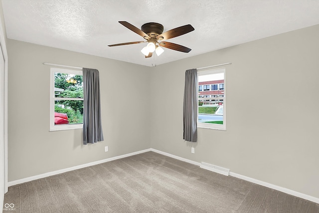 5015 Nowland Ave, Indianapolis, IN 46201 - carpeted spare room featuring a ceiling fan and a textured ceiling