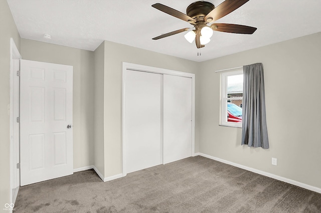 5015 Nowland Ave, Indianapolis, IN 46201 - unfurnished bedroom with carpet, a closet, and a ceiling fan