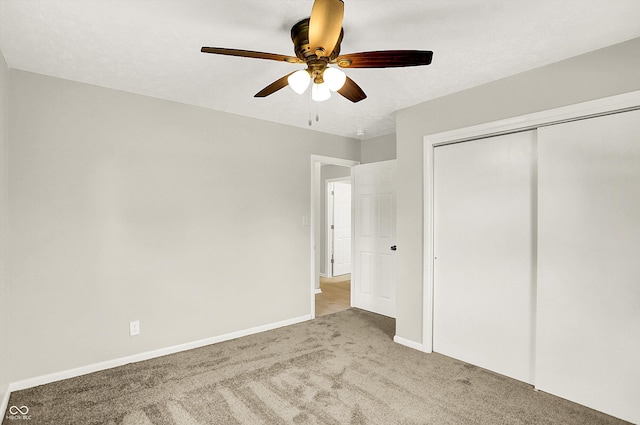 5015 Nowland Ave, Indianapolis, IN 46201 - unfurnished bedroom featuring carpet floors, a closet, and a ceiling fan