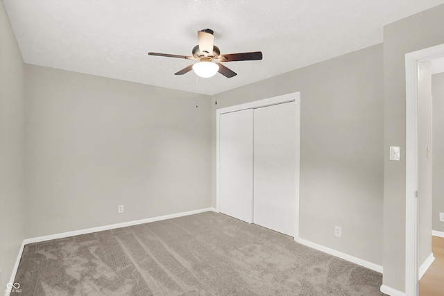 5015 Nowland Ave, Indianapolis, IN 46201 - unfurnished bedroom with a closet, carpet floors, and a ceiling fan