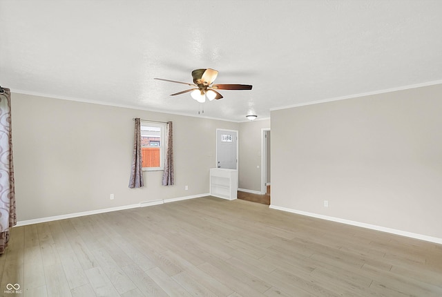 5015 Nowland Ave, Indianapolis, IN 46201 - empty room with a ceiling fan, light wood finished floors, and ornamental molding