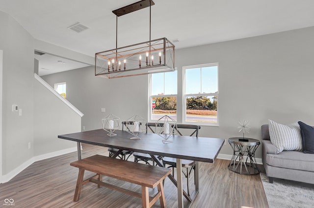 7687 Marin Pkwy, Cumberland, IN 46229 - dining room with wood finished floors and a chandelier