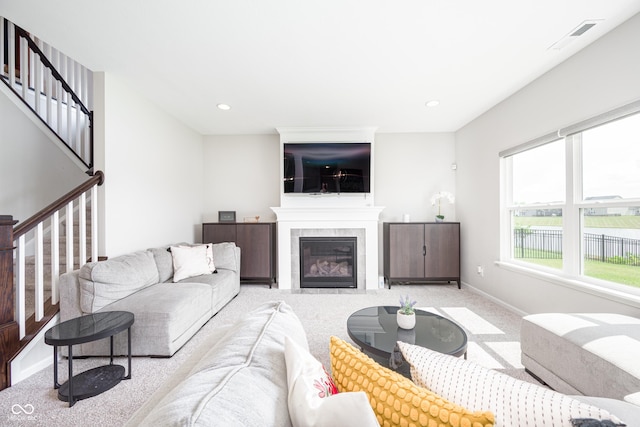 7147 Prelude Rd, Brownsburg, IN 46112 - carpeted living area with stairway, a tile fireplace, and recessed lighting