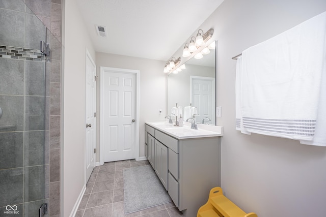 7147 Prelude Rd, Brownsburg, IN 46112 - full bath featuring double vanity, tile patterned floors, and a tile shower