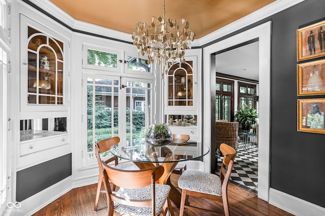 4455 Broadway St, Indianapolis, IN 46205 - dining room featuring dark wood finished floors, plenty of natural light, a chandelier, and crown molding
