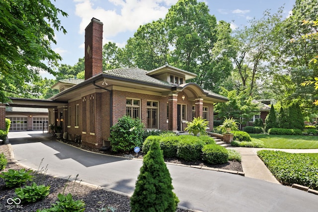 4455 Broadway St, Indianapolis, IN 46205 - view of front of house featuring brick siding and a chimney