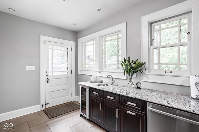 4455 Broadway St, Indianapolis, IN 46205 - kitchen featuring dishwasher, wine cooler, plenty of natural light, light stone countertops, and recessed lighting